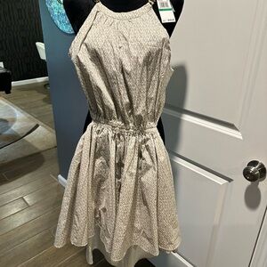 MK back out dress with gold link strap